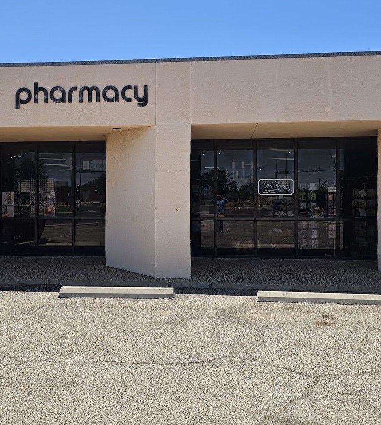University Pharmacy storefront in Odessa, Texas.